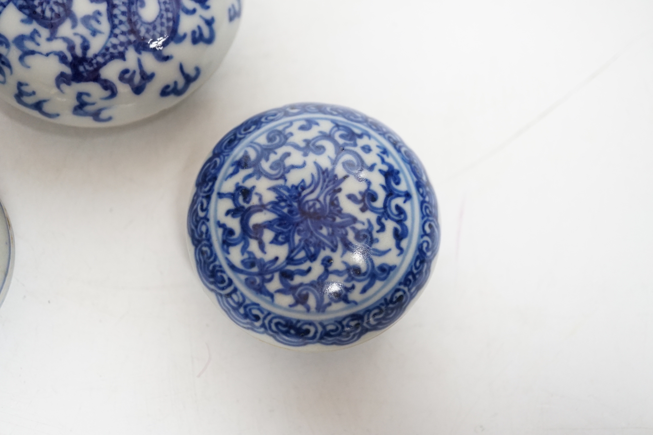 Three Chinese blue and white seal paste boxes and covers, Qing dynasty, largest 7cm in diameter
